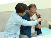 Caring for elderly persons suffering from stroke – dressing and undressing techniques